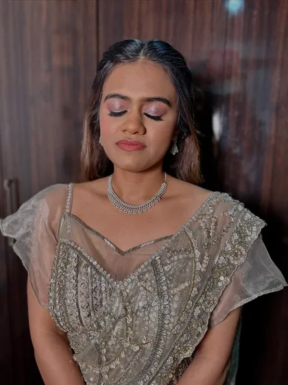 A close-up of the soft pink shimmer on the lids, a key element of this dreamy and elegant makeup look.
