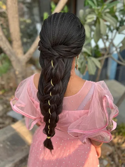 The full back view of the mermaid braid, showing its length and the beautiful way it tapers down. This is a true statement hairstyle.