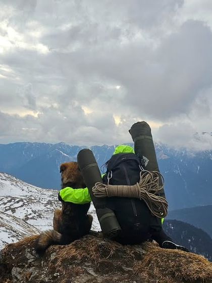 Sharing a quiet moment overlooking the mountains. My pack holds everything I need, and my body is the engine that gets me here. This is the essence of self-sufficiency that we build through training.