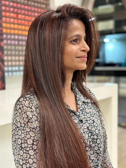 Another angle of the stunning cherry brown hair color. It's a versatile shade that adds depth and dimension while being subtle enough for an everyday look.