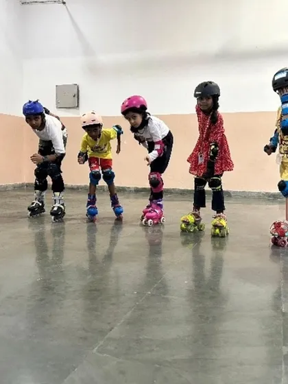 Our skating sessions are designed to teach balance, coordination, and perseverance. In this image, a group of young skaters gets ready for their lesson, fully equipped with safety gear, demonstrating our commitment to providing a secure and encouraging environment for learning new sports.