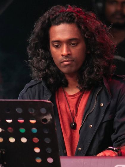 Our keyboardist, deep in concentration during our set at the Bengaluru Ganesh Utsava. His melodic lines and synth textures add a contemporary layer to our traditional roots.