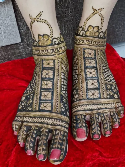 Another view of the intricate floral feet design, showing the beautiful symmetry and detailed line work.