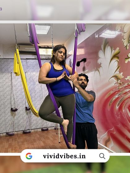 Building trust is key. With an instructor's guidance, students can safely explore poses like this tree pose variation in the hammock, enhancing balance and focus.