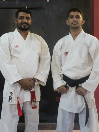 Posing with the examiners after a successful belt grading test at my academy. I believe in bringing in experienced masters to ensure our standards are high.