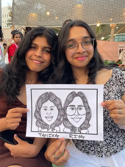 Capturing the fun between friends at an outdoor event at BKC, Bandra. A caricature is a great way to remember a fun day out with the people you care about.