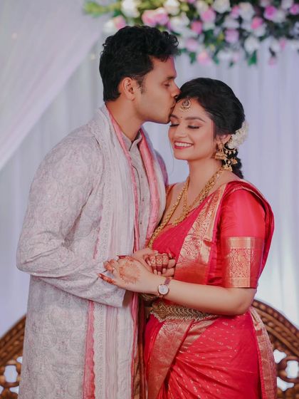 A tender moment from an engagement ceremony. The groom's kiss on the bride's forehead is a classic, heartfelt gesture that I love to capture.