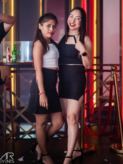 A chic and casual look from two friends enjoying their night out.