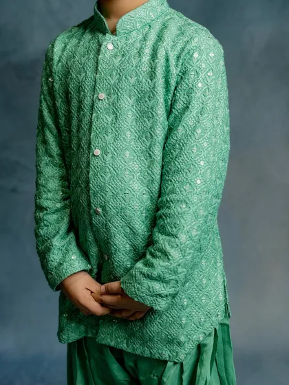 A detailed shot of the mint green Patiala kurta. The fabric's unique weave adds a subtle elegance to this comfortable and easy-to-wear festive outfit.