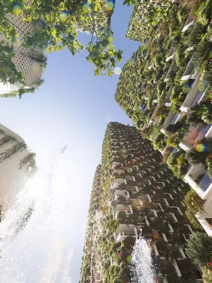 The Sky Gardens towers from below, a perspective that emphasizes their height and the incredible density of the vertical planting.