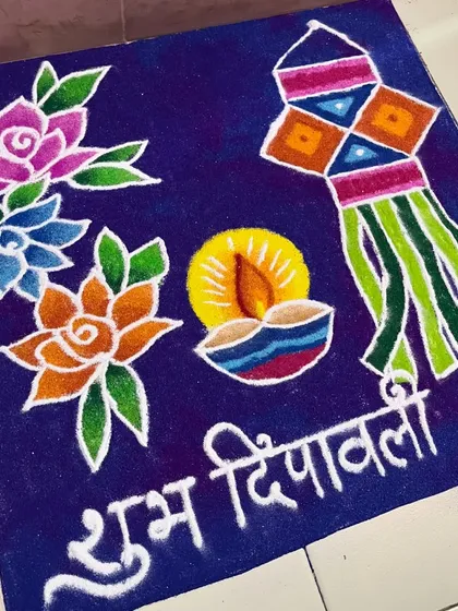 A simple yet elegant Diwali design with flowers, a diya, and a 'kandil' lantern. The "Shubh Deepavali" message in Marathi adds an authentic touch to the festive decor.