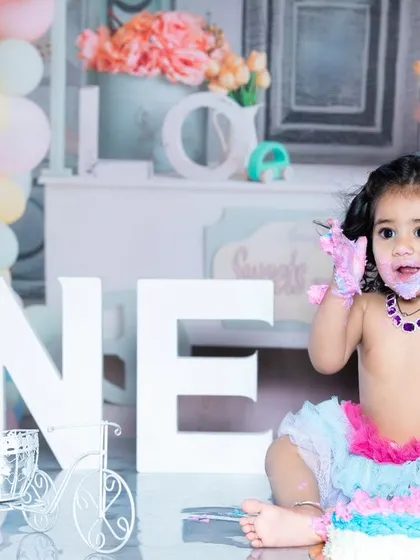 Nothing says 'first birthday' like a messy cake smash! I focus on capturing the pure joy and chaos of this milestone. It’s less about perfect poses and more about genuine, happy moments.
