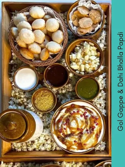 A complete chaat experience in one platter. This setup includes everything you need for Gol Gappe and Dahi Bhalla Papdi, allowing your guests to assemble their own chaat just the way they like it.