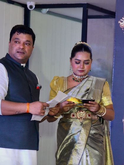 A quick script review with a co-organizer during the Lemon Tree event. Behind the scenes, I ensure every detail is perfect for a seamless show.