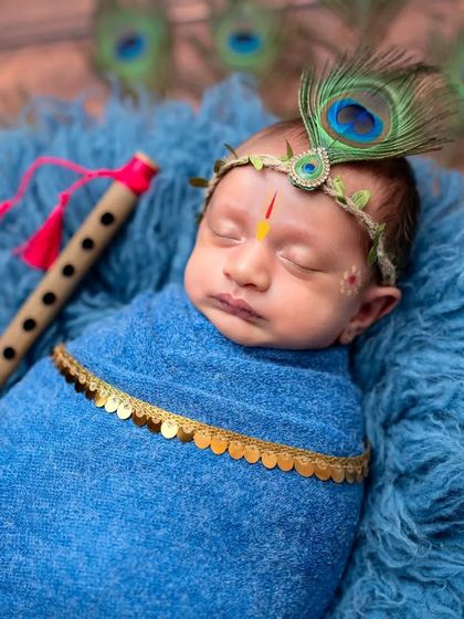 Another sweet pose from the little Krishna session, showing the baby peacefully sleeping with his flute. These sessions are a wonderful way to honor your faith and traditions.
