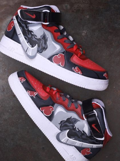 A top-down view of the Itachi custom AF1s, showing the artwork on both shoes.
