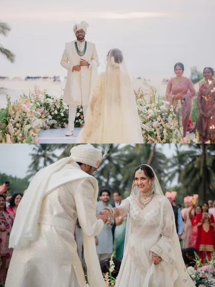 The moment the groom takes his bride's hand at their beachside wedding ceremony in South Goa. The ocean setting adds a serene and romantic touch.