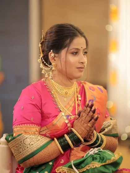 The bride during a quiet moment in her ceremony, her hands joined in prayer.