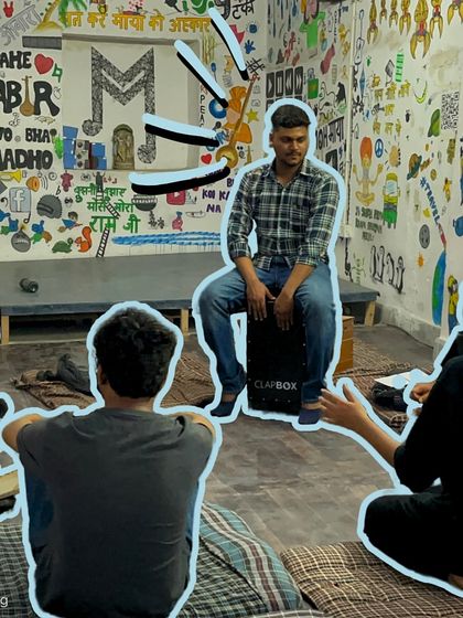 An instructor plays the cajon, adding a rhythmic element to the vocal class. We incorporate various instruments to create a richer and more dynamic musical experience.