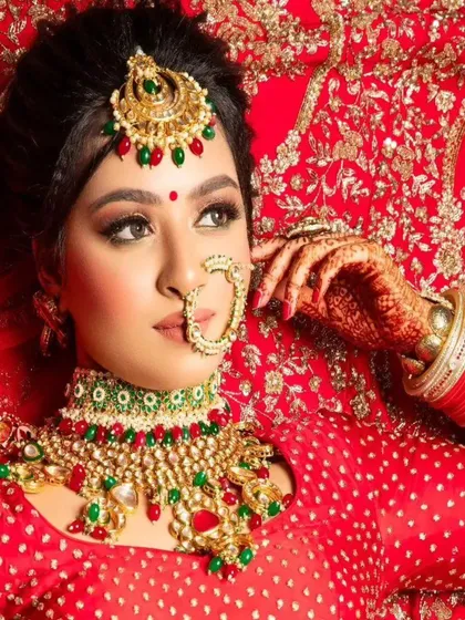 A stunning red and green bridal set. The choker features a mix of red and green stones, making it a versatile choice for traditional lehengas.