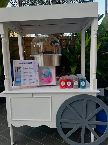 Clean, elegant, and ready for any occasion. Our classic white wheeled cart for cotton candy can be customized to fit perfectly with your party's theme and decor.