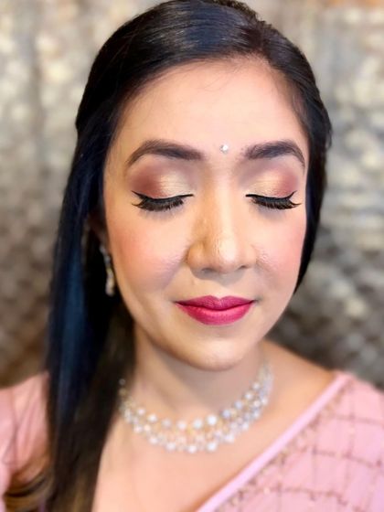 A beautiful, soft glam look for the sister of the bride, featuring rosy cheeks and a matching pink lip.