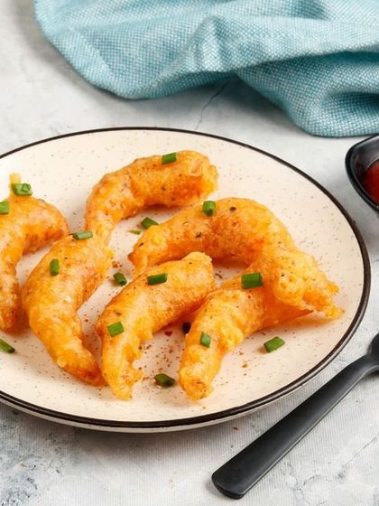 Another view of our golden Fried Prawns, showcasing their crispy texture. Perfect for dipping in your favourite sauce.
