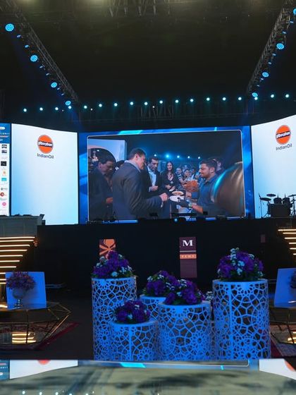 The main stage for the India Luxe Gourmet event, featuring a massive curved LED screen and professional lighting. The setup was designed to be impactful and provide a clear view for all attendees.