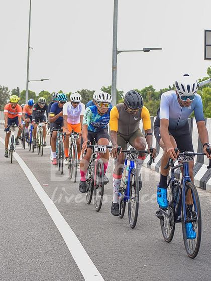 A long line of racers snakes along the highway. My road races often feature long distances, testing the endurance of every participant.
