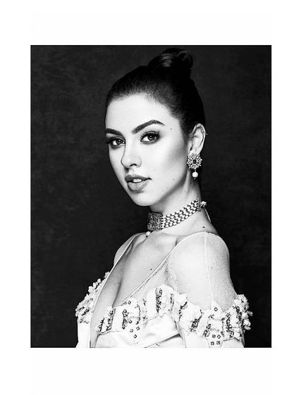 A classic black and white portrait showcasing a beautiful off-shoulder gown. This type of timeless styling ensures your wedding photos remain elegant and fashionable for years to come.