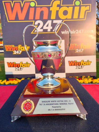The T.B. Hanumantharaj Memorial Trophy, set against the backdrop of our sponsor Winfair247's branding, ensuring visibility throughout the race day's events.