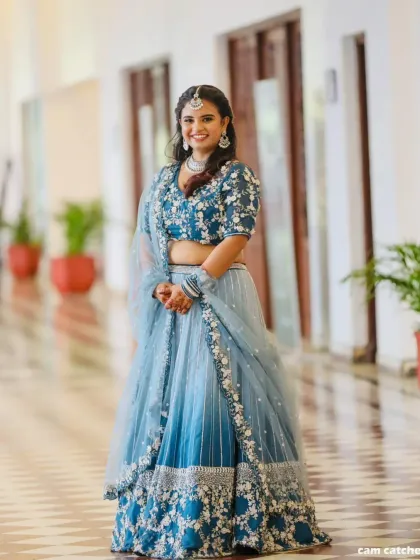 Nothing makes us happier than seeing our clients shine. This beautiful client is wearing one of our popular blue ombre lehengas, perfect for a wedding guest or bridesmaid. We altered it for her perfect fit, and she looks absolutely stunning.