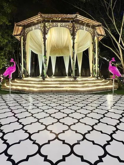 We brought a touch of whimsical grandeur to this sangeet with two magnificent pink peacock props. These custom-designed pieces with floral tails flanked the stage, creating a truly unique and memorable focal point.