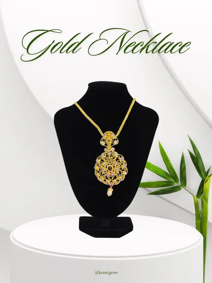 A full view of the traditional gold pendant necklace on a display bust, showcasing its regal presence and intricate design. A true statement piece for any celebration.