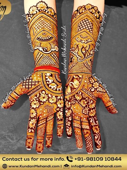 This bridal design is filled with auspicious symbols like elephants and swans, along with dense floral and geometric patterns.