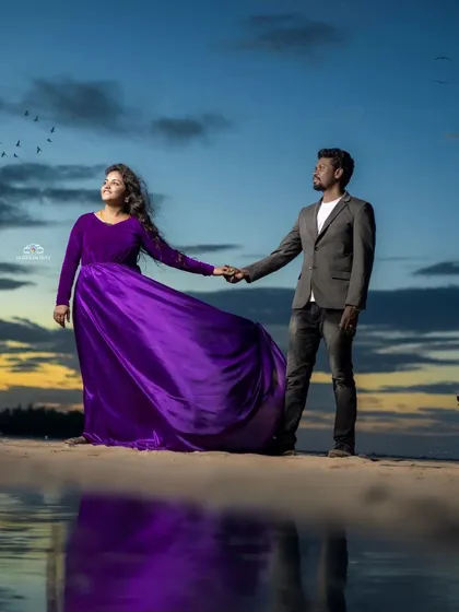 I love how this purple velvet and satin gown looks against the sunset. It's a perfect choice for a romantic pre-wedding shoot, offering a rich color and a fabric that catches the light beautifully.