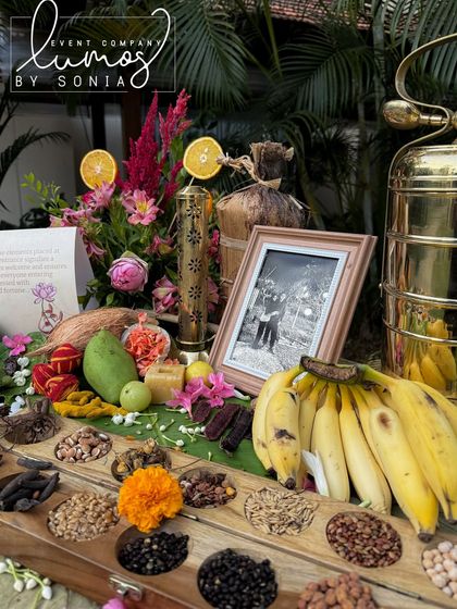 Another view of the Navadhanyam display, showcasing the variety of sacred grains and traditional brass elements.