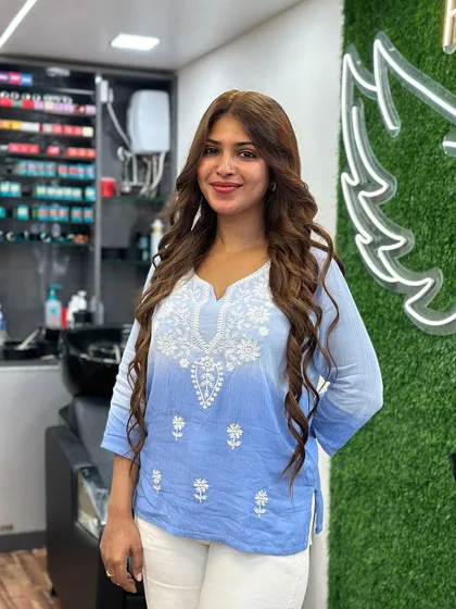 A happy client showing off her new, healthy, no bleach color.