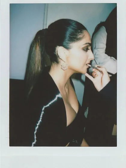 Another instant film shot of Sonam Kapoor during her makeup session, capturing the quiet moments before the camera rolls.