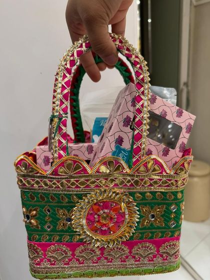 Create your own stunning festive hamper with us. This green and pink basket is packed with a selection of our most delectable homemade treats, perfect for Diwali gifting.