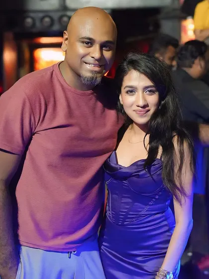 Posing with a guest. I always make an effort to connect with the crowd and make them feel welcome.