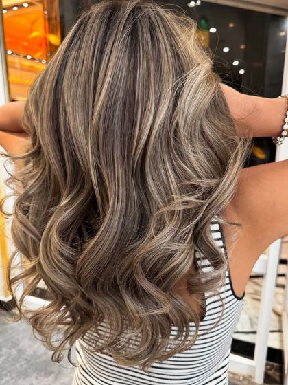 Another view of the ash blond balayage, showing the beautiful dimension and texture created by the highlights.