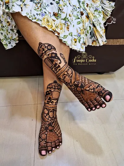 We make sure the henna artistry extends from head to toe. This is an example of our intricate bridal-style leg henna, featuring majestic elephants in a palanquin, creating a complete and royal look for any special occasion.