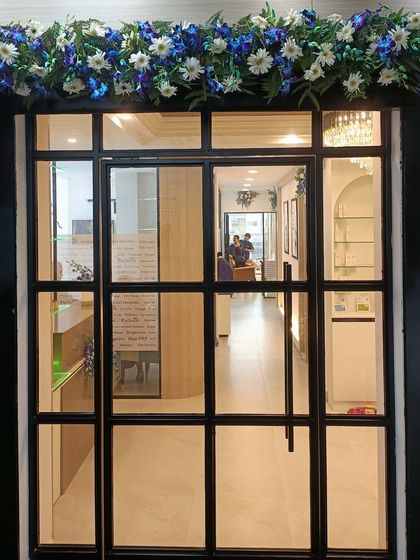 The entrance to our new Vasundhara clinic, adorned with flowers for our opening. We are ready to welcome you into our new home for health and beauty.