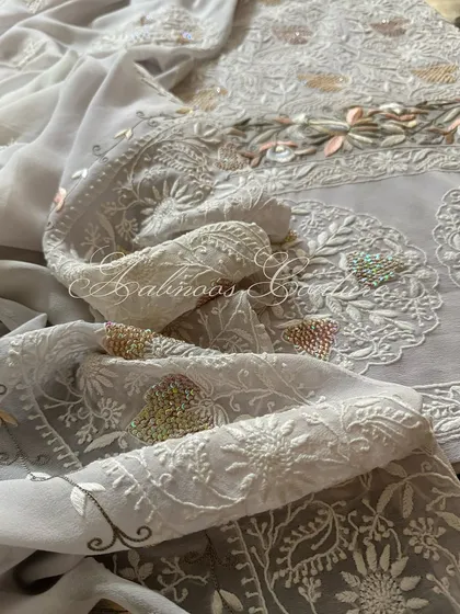 Another view of the draped dupatta, showing its graceful fall.
