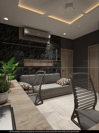 This view of the home office shows a comfortable sofa for taking breaks, as well as plants to bring a touch of nature indoors.