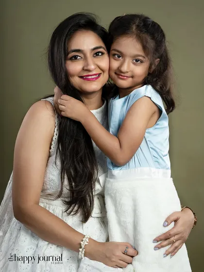 The special bond between a mother and her daughter is something I cherish capturing. This simple, elegant studio portrait focuses on their close connection and shared affection.