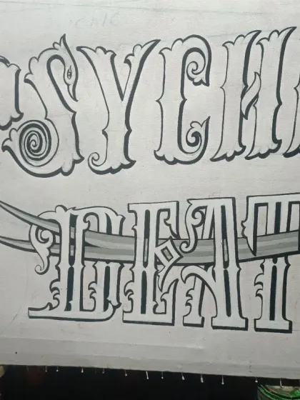 The full outline for "PSYCHIC DEATH" is done, showing the sword-pierced lettering.