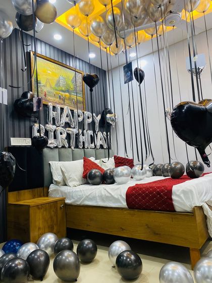 A wide shot of the black and silver themed birthday room, demonstrating a sleek and contemporary approach to celebration decor.