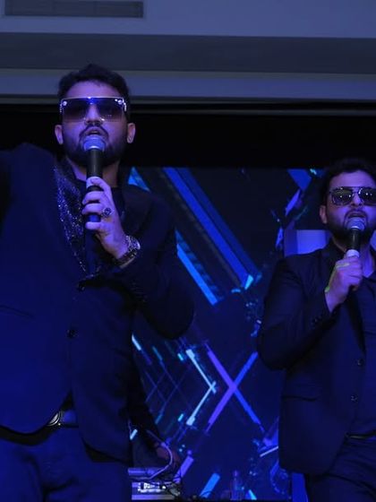 The lead singers of Dilli Rockers Band commanding the stage during a New Year's performance. I focus on capturing the artists' stage presence and energy.